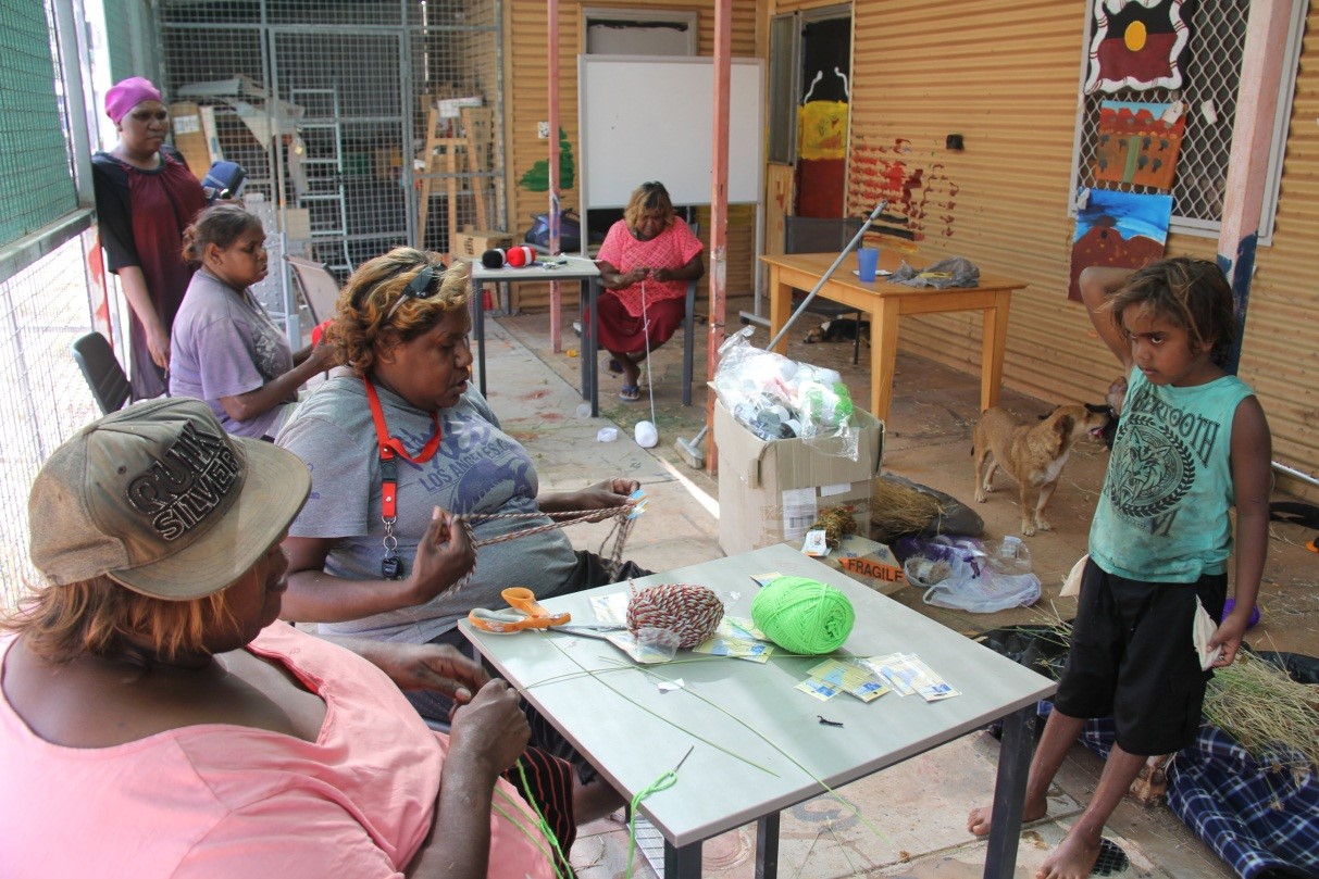 Valerie (front left) teaching the Irrungadji ladies to weave